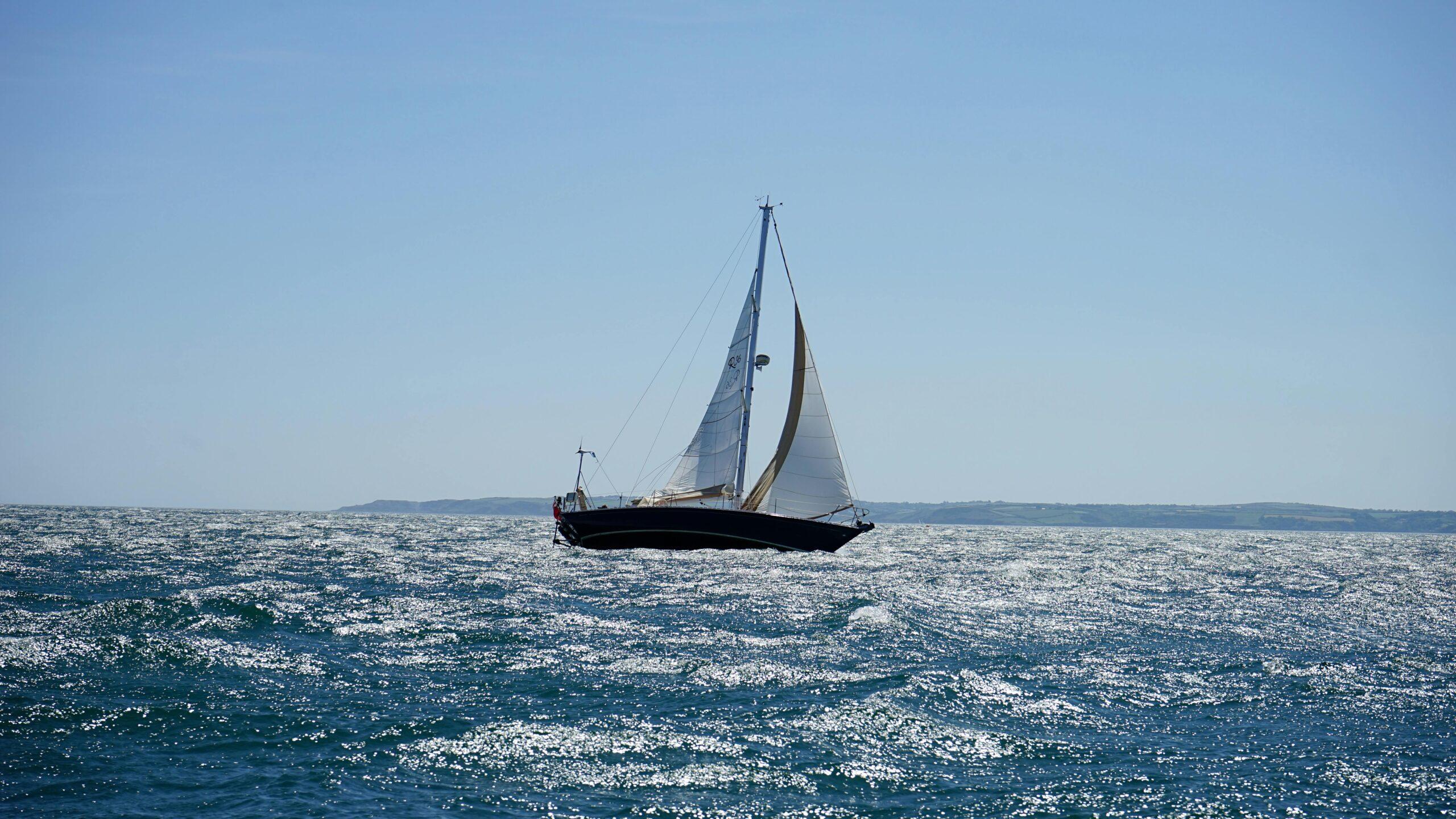 Sailboat under sail on open water