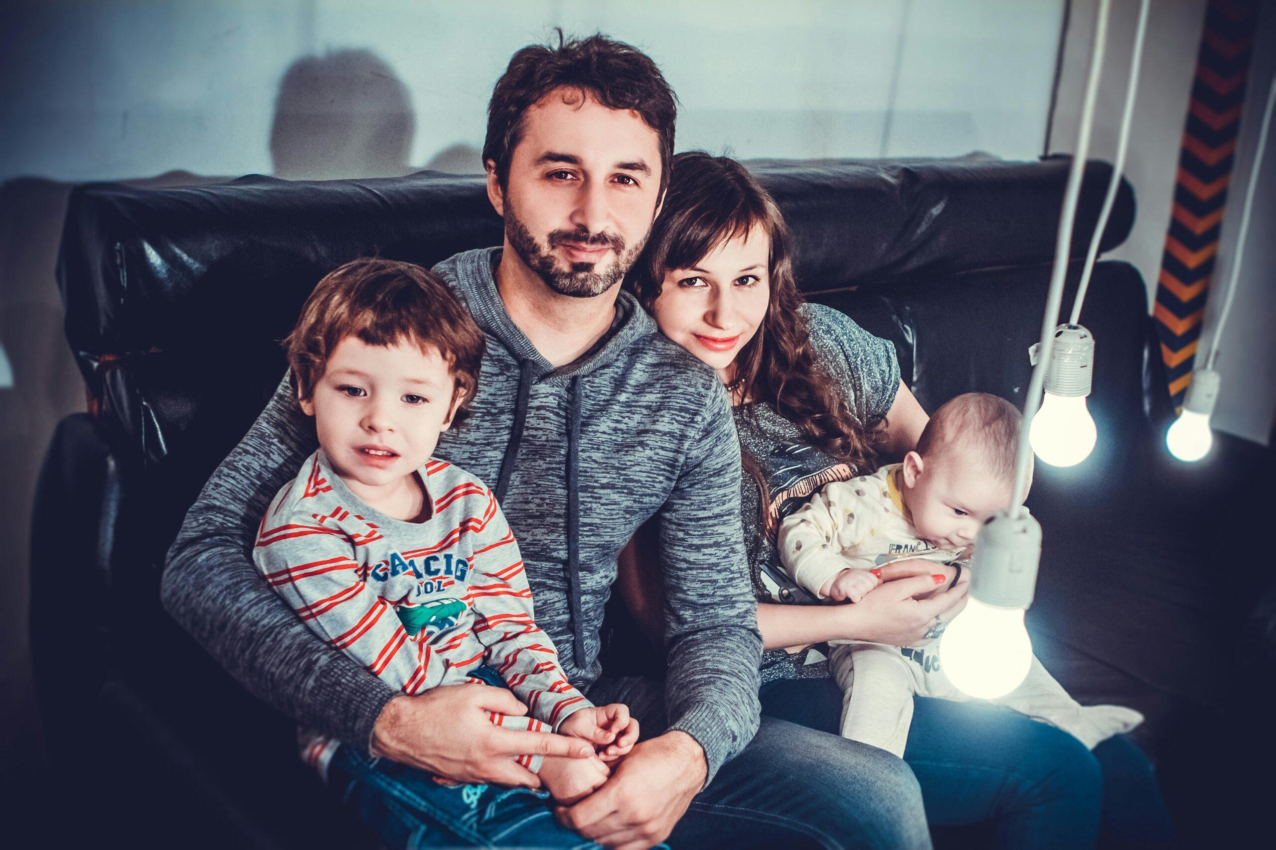 Young family sitting together at home