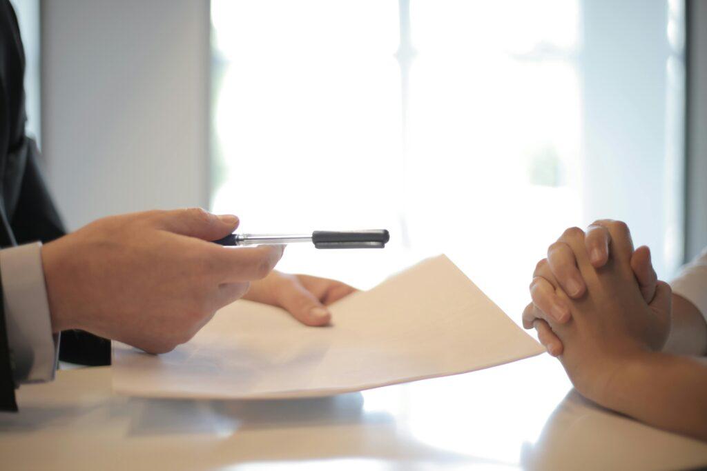 Signing an insurance policy at the agent's desk